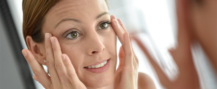 woman moisturising skin
