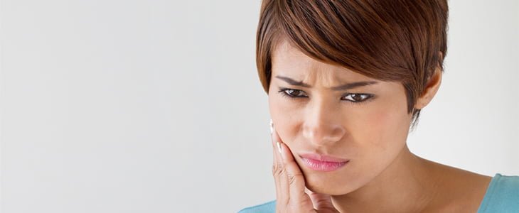 woman with tooth pain