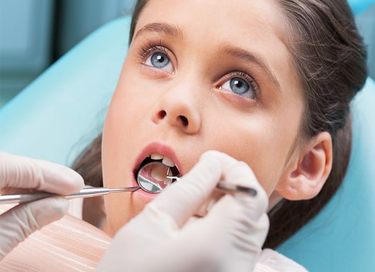 Why are children not attending the dentist?
