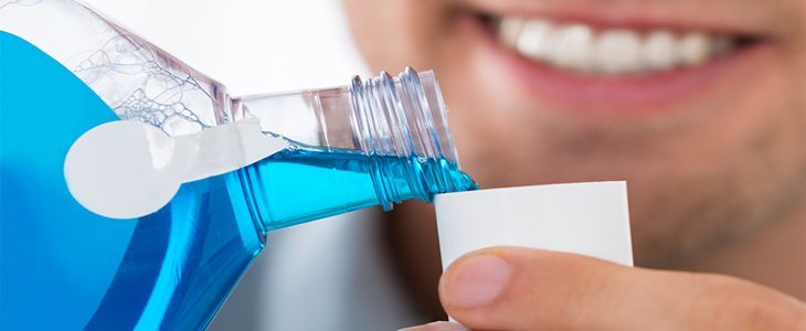 Washing out mouth with mouthwash
