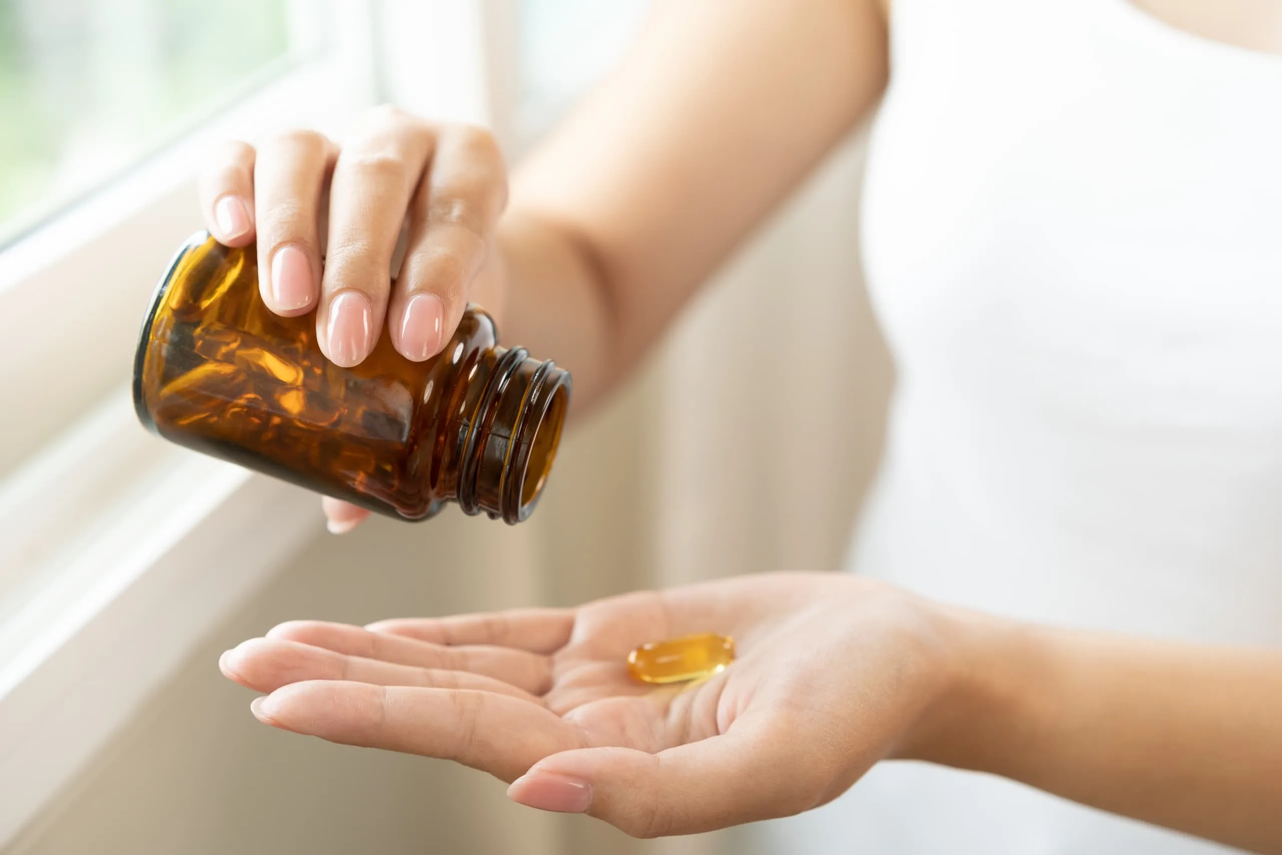 woman eating supplements