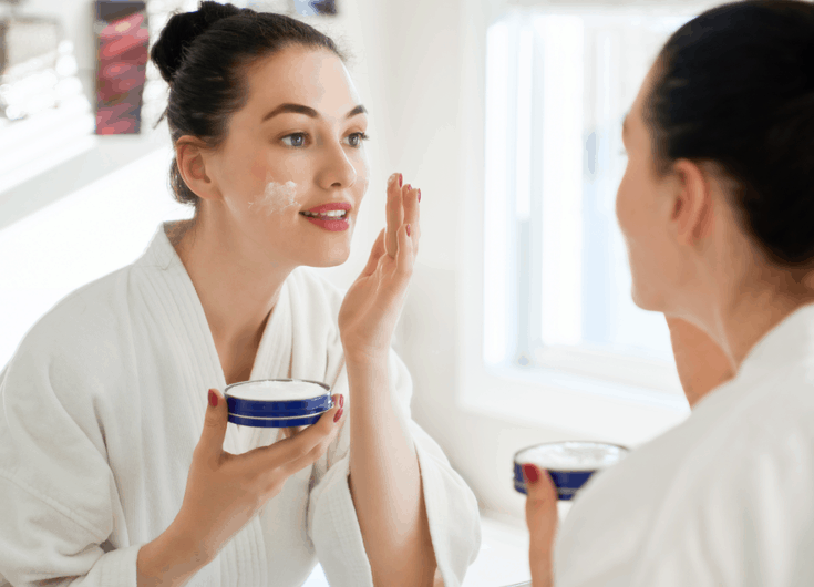 woman using face cream