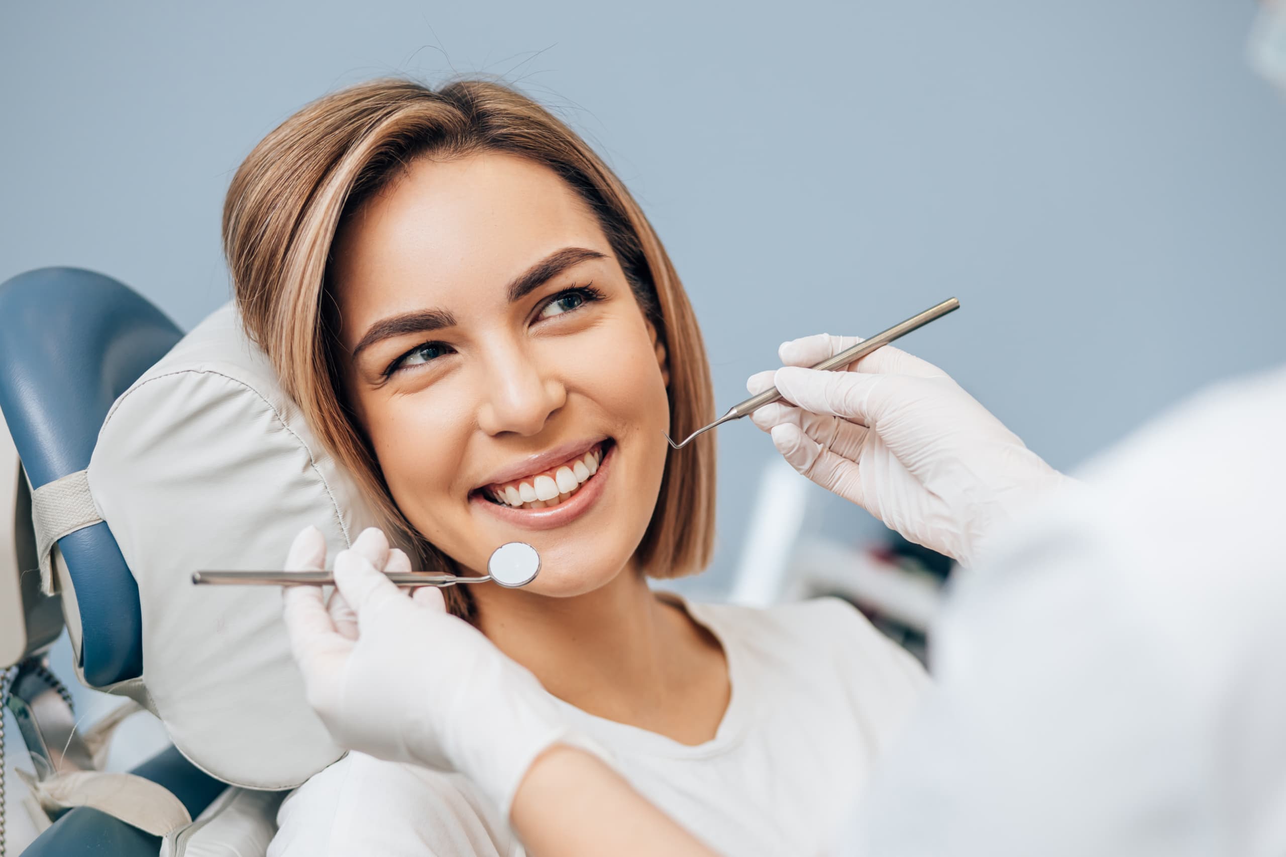 Woman at dentist smiling