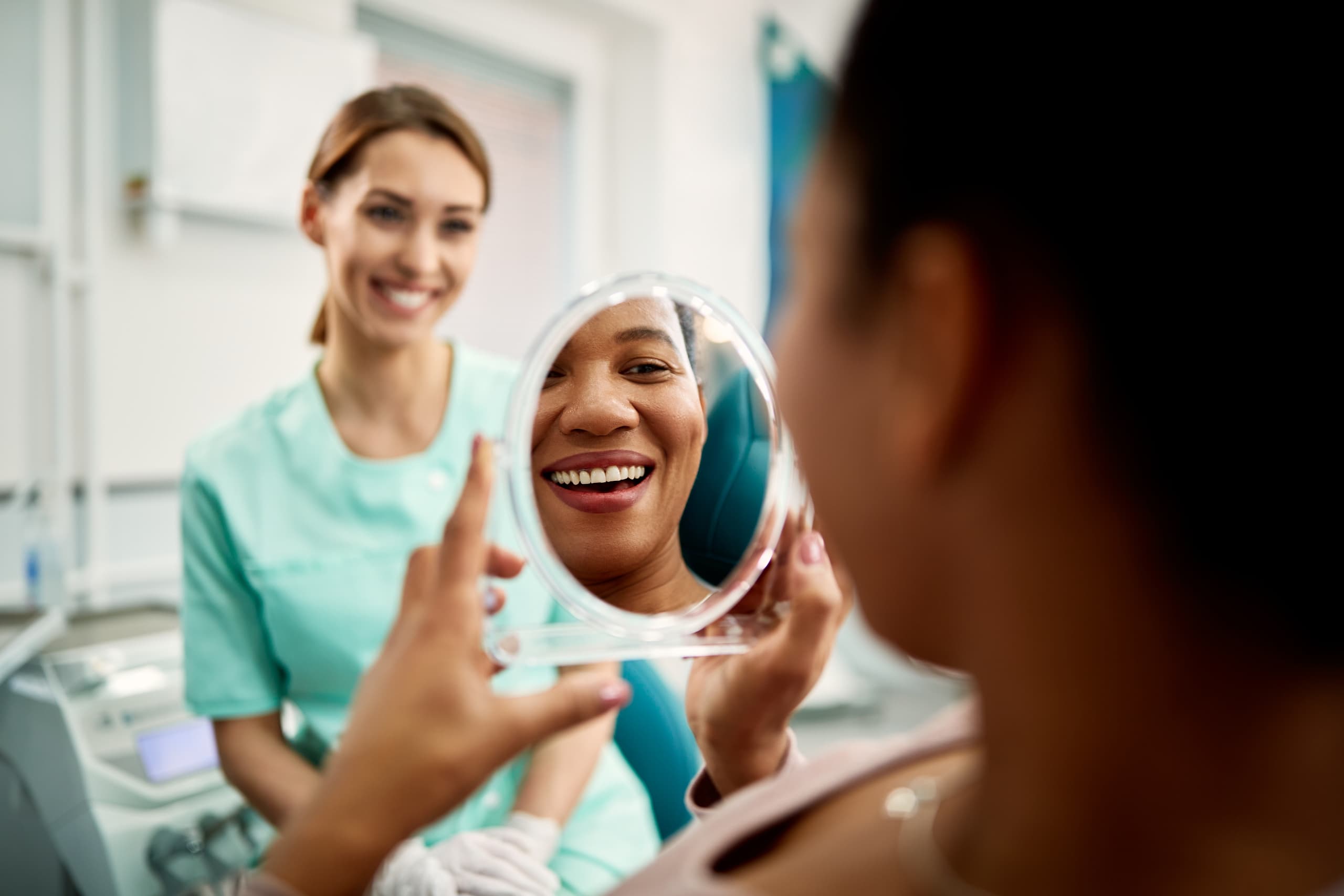 woman smiling in mirror